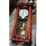 Mahogany framed pendulum wall clock by W Widdop with key 25"