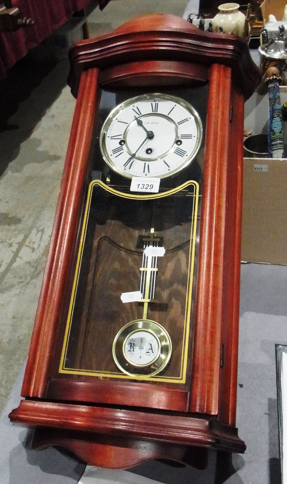 Mahogany framed pendulum wall clock by W Widdop with key 25"