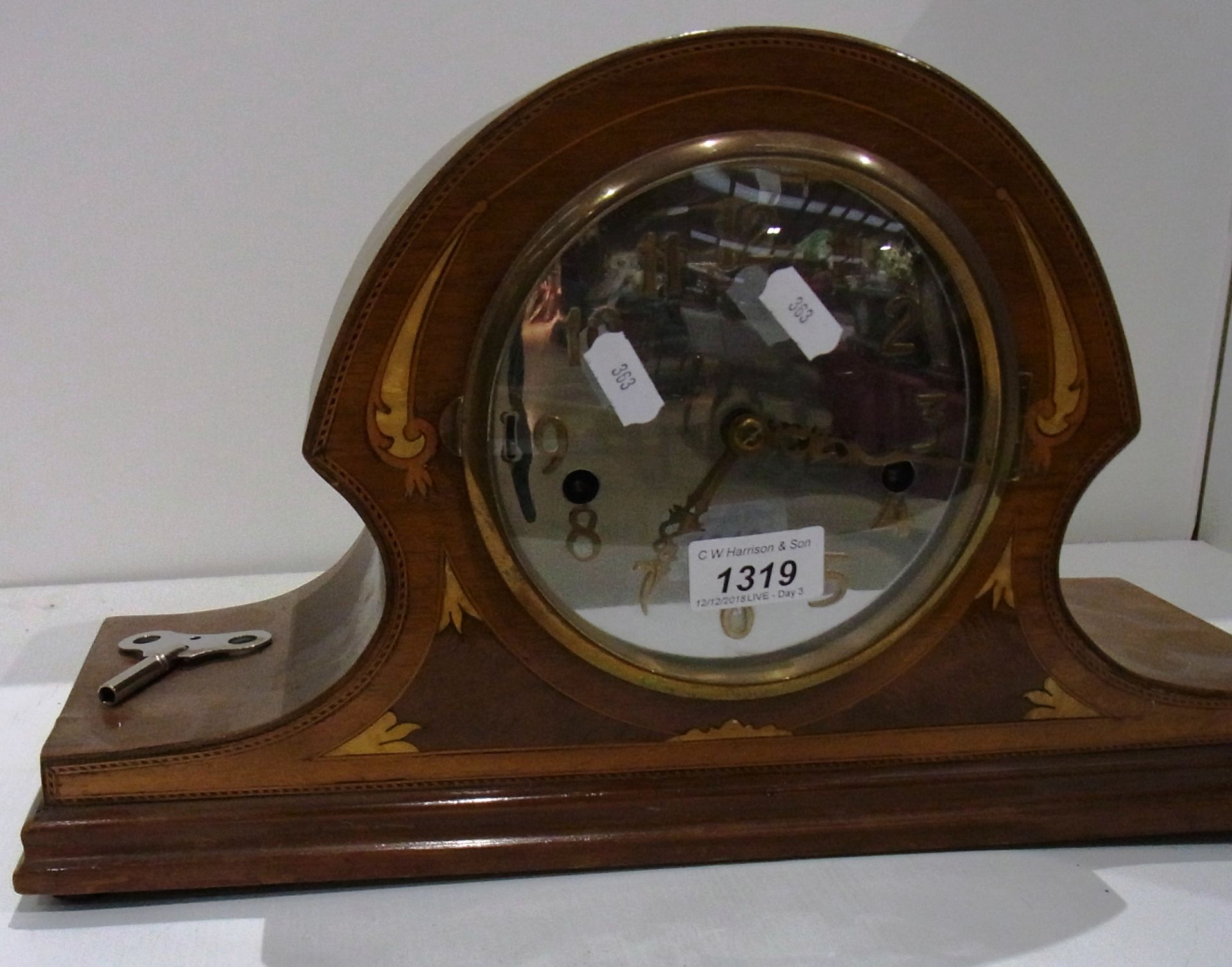 Mahogany cased Napoleon hat mantel clock with key 10" mirrored dial