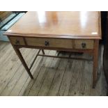 A mahogany three drawer side table on square tapered legs