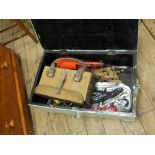 A painted pine tool box containing various saws,