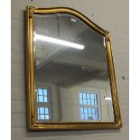 A rectangular gilt wall mirror and an oval ornate gilt mirror