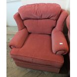 A modern maroon upholstered armchair
