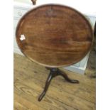 A Georgian mahogany circular snap top table