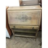 A reproduction oak and leaded light cabinet and a satinwood secretaire