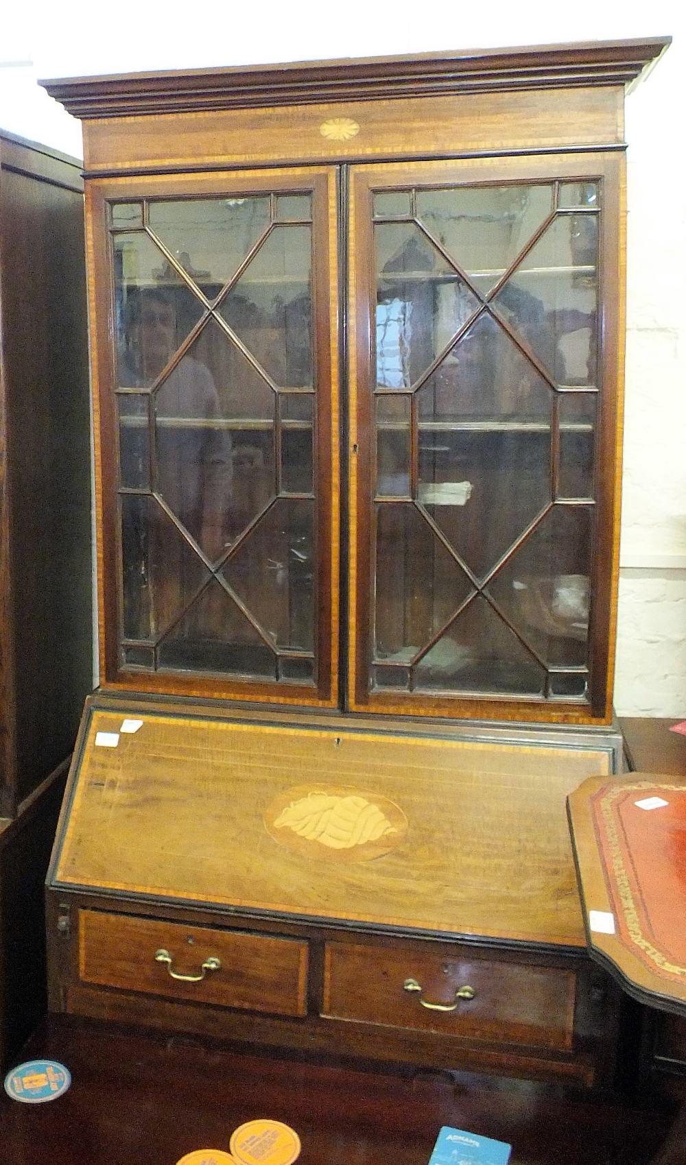 An Edwardian inlaid and cross banded bureau bookcase