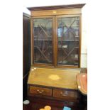 An Edwardian inlaid and cross banded bureau bookcase