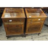 A pair of walnut and cross banded bedside cabinets