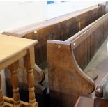 A long 19th Century oak and pine church pew,