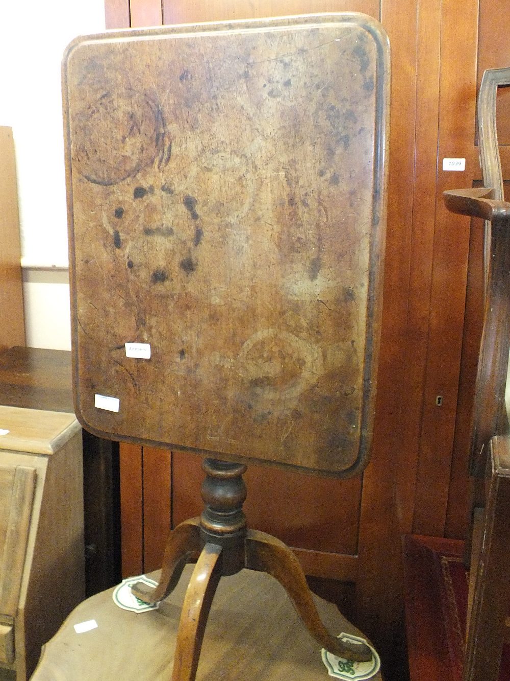 A 19th Century rectangular mahogany snap top table plus an Edwardian shaped top table