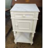 A marble top bedside cabinet,