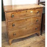 A Georgian mahogany three drawer chest on bracket feet