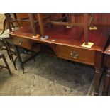 A mahogany two drawer writing desk with maroon tooled leather top on spiral twist legs