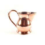 A 19th Century seamed copper ale jug of bulbous form with large spout,