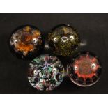 Four Caithness Peter Holmes paperweights, two PH canes,
