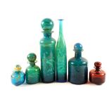 Five pieces of Mdina glass lidded bottles in varying patterns plus one other tall vase,