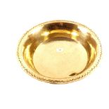 An early 19th Century deep brass dairy bowl with punch decorated rim,