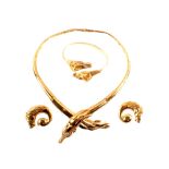 A suite of gold jewellery of horse design consisting of a link necklace with cross over horse head