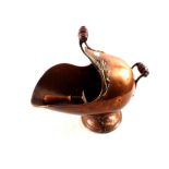 A 19th Century copper coal helmet and scoop