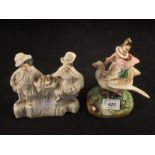 A Victorian Staffordshire witch on swan plus a two figure group