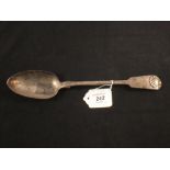 A silver serving spoon,