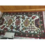 An Indian floral rug,