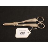 A pair of silver grape scissors,