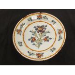 An 18th Century Delft polychrome floral charger,