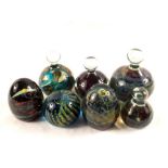 Seven Mdina glass paperweights in various forms and designs,