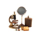 A Prior brass microscope and accessories,