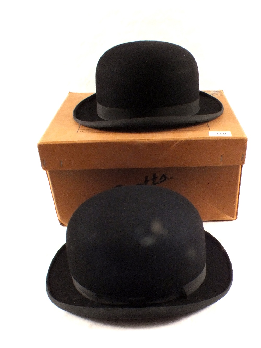 Two stiffened bowler hats by Dunn & Co and Sandon Saddlery Co