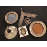 Two small silver circular frames (as found), a porcelain photo frame,