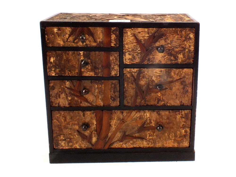 A Meiji period Japanese bark and boxwood marquetry cabinet,