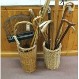 Wicker and string stick stands plus sticks, fishing rod,