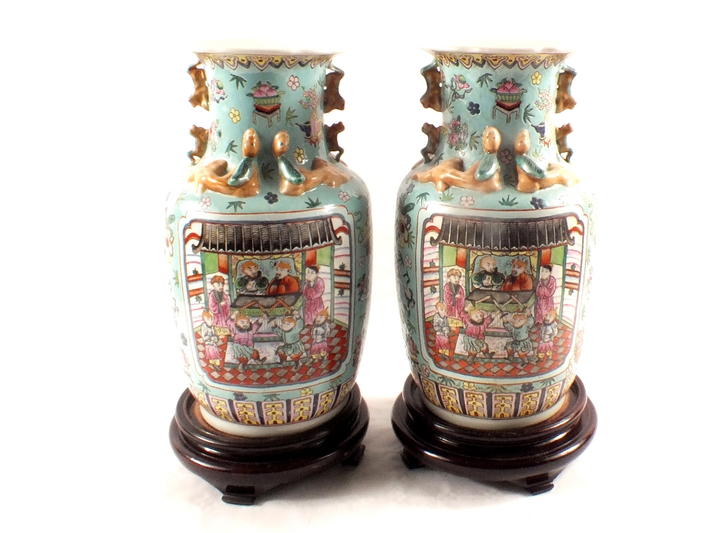 A pair of Chinese blue ground vases with figure and floral decoration,