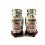 A pair of Chinese blue ground vases with figure and floral decoration,