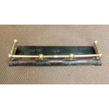 A 19th Century brass rail and painted iron fender,