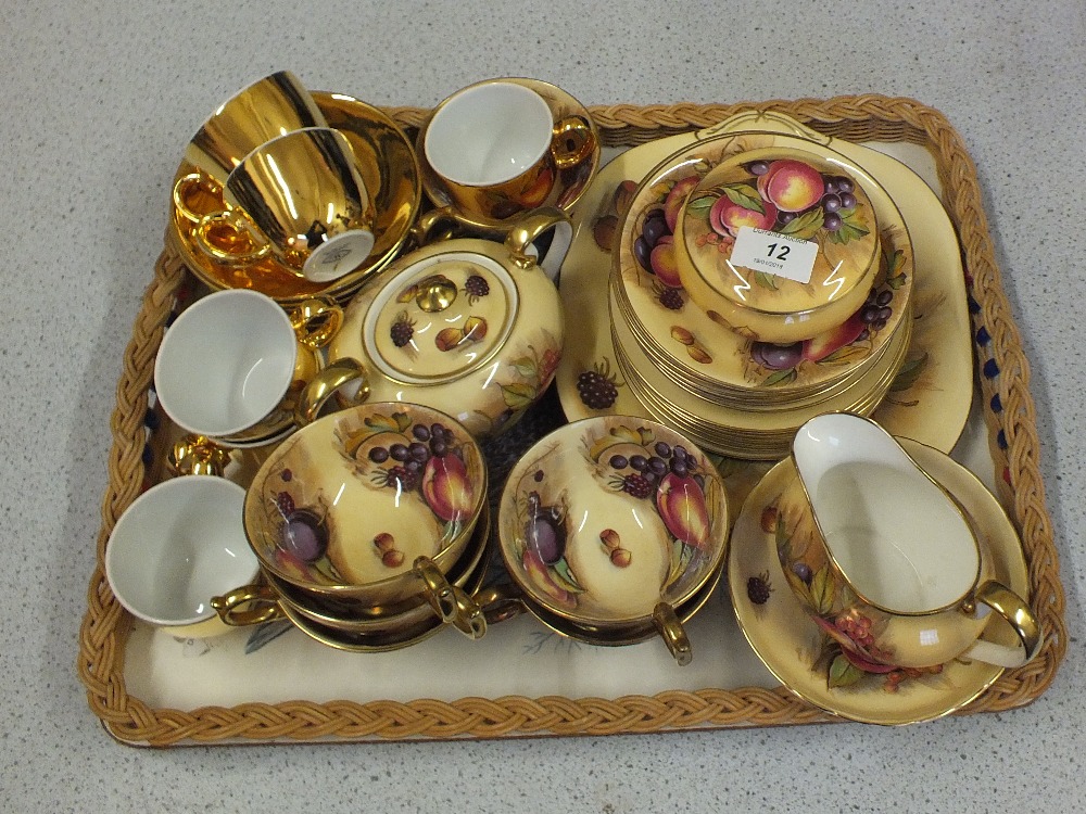 Aynsley fruit decorated tea wares plus a Royal Worcester gilt coffee set