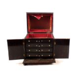 A William IV rosewood and mother of pearl inlaid rising top four drawer jewellery cabinet