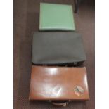 A Revelation leather suitcase plus two others,