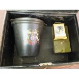 A tin trunk containing a leather fire bucket, cash tin,