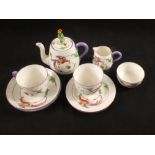 A Crown Staffordshire floral and bird decorated part breakfast set