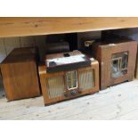 Five wooden cased mains radios, Cossor, Bush, Invicta and McMichael (2) plus a speaker,