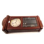 A mahogany striking wall clock