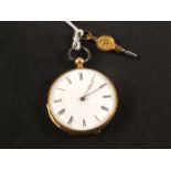 A lady's yellow metal fob watch with engraved decoration,