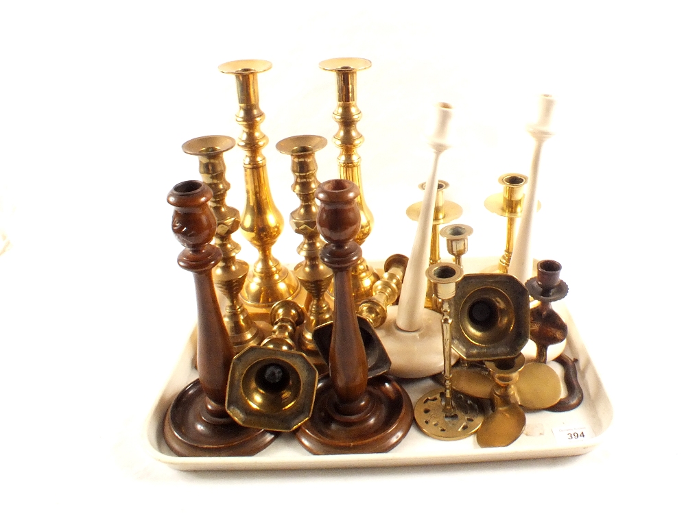 A quantity of Victorian brass and other candlesticks