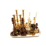 A quantity of Victorian brass and other candlesticks