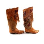 A pair of Nashville boots in multiple types of leather