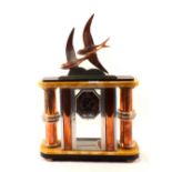 An Art Deco marble, chrome and copper mantel clock with copper swallow mount, signed E.