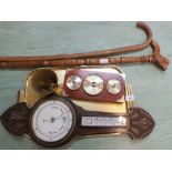 A carved oak aneroid barometer, one other combination barometer,